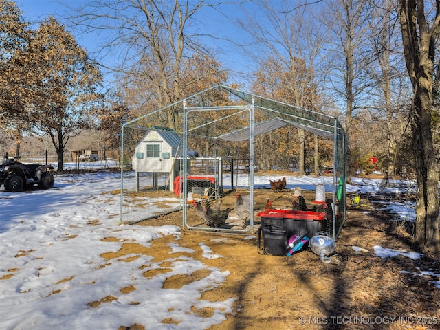 view of yard layered in snow