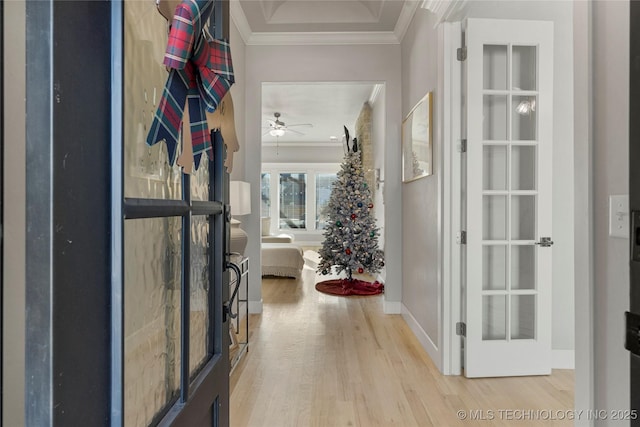 corridor featuring light hardwood / wood-style floors and ornamental molding