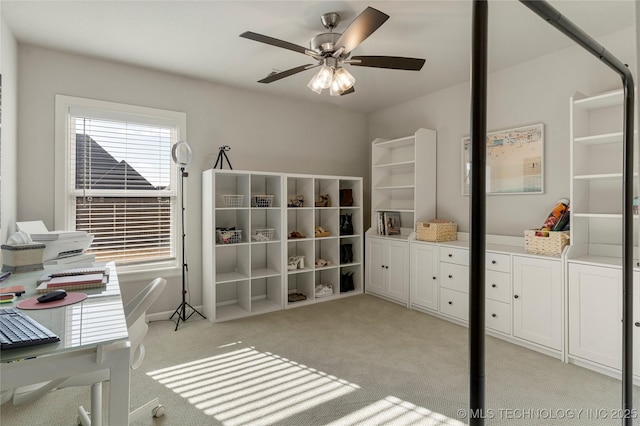 office space with ceiling fan and light colored carpet