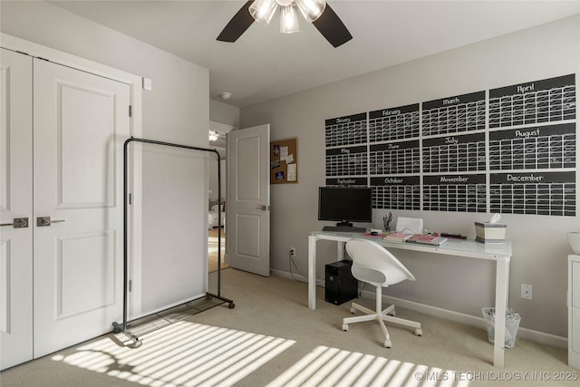 office area featuring ceiling fan and light carpet