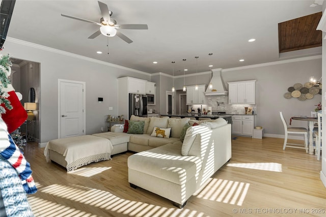 living room with ceiling fan, light hardwood / wood-style floors, and ornamental molding