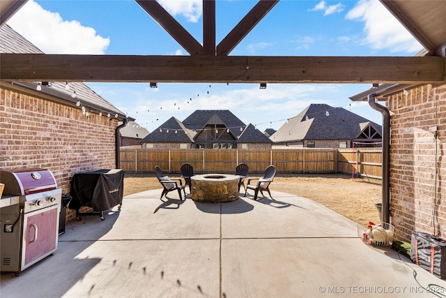 view of patio featuring grilling area and an outdoor fire pit