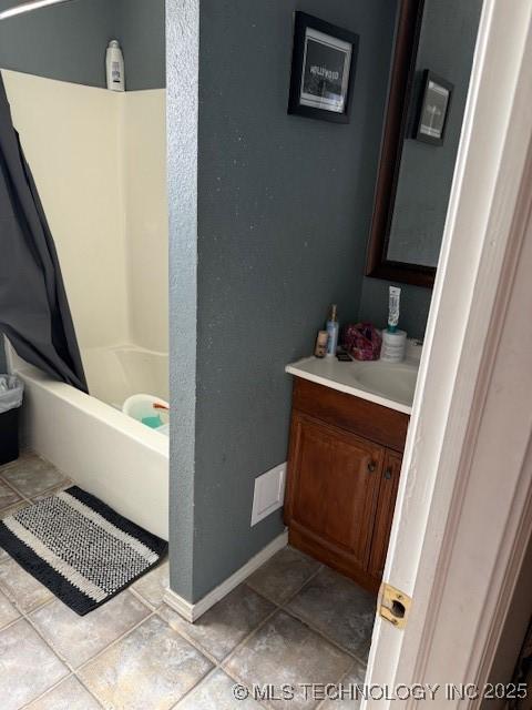 bathroom featuring shower / tub combo, vanity, and tile patterned floors