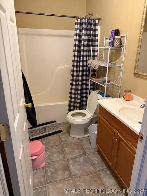 full bathroom with vanity, shower / bathtub combination with curtain, and toilet