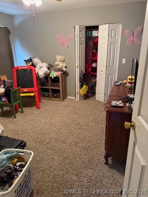 playroom featuring carpet flooring and ceiling fan