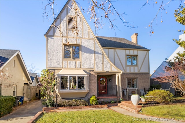 tudor house with a front lawn