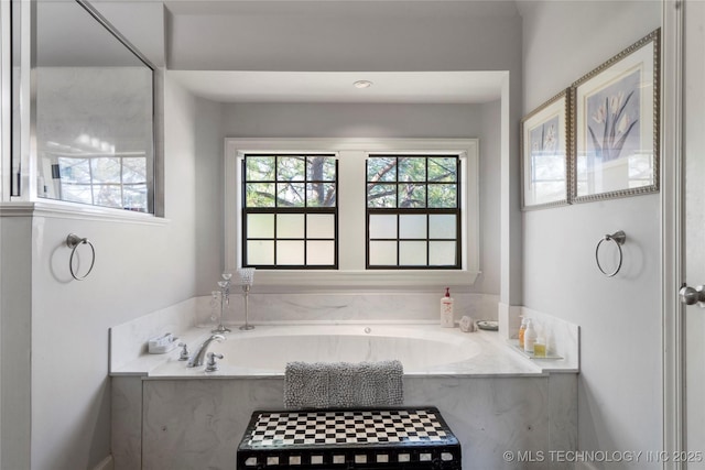 bathroom featuring a tub to relax in