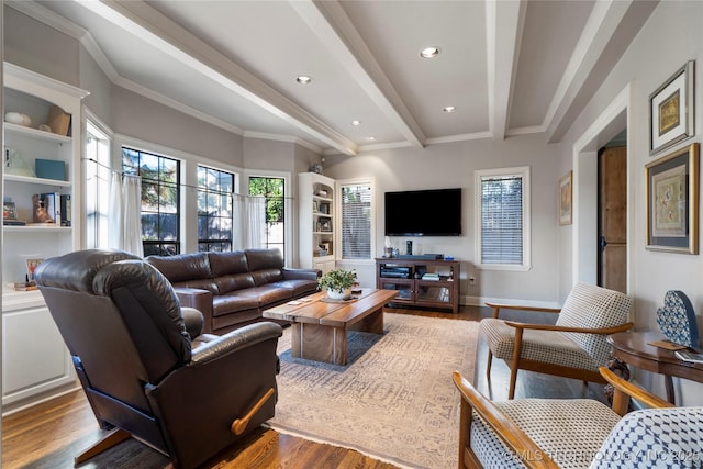 living room with beamed ceiling, ornamental molding, and wood-type flooring