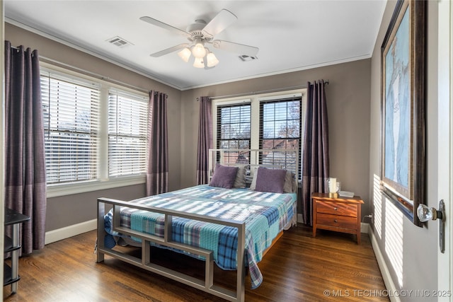 bedroom featuring multiple windows, ceiling fan, and dark wood-type flooring