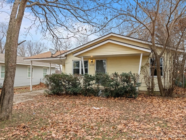 single story home featuring a carport