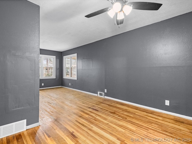 unfurnished room featuring ceiling fan and light hardwood / wood-style floors