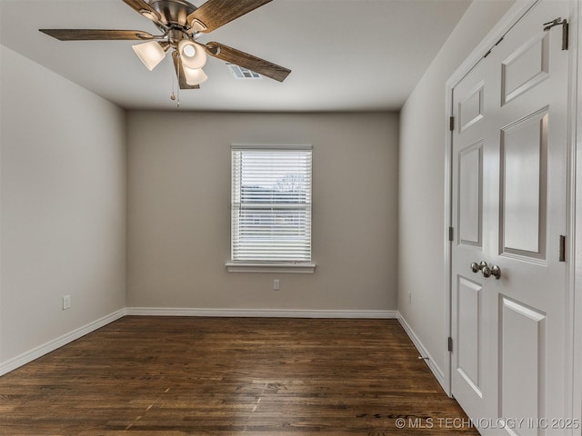 unfurnished room featuring ceiling fan and dark hardwood / wood-style floors