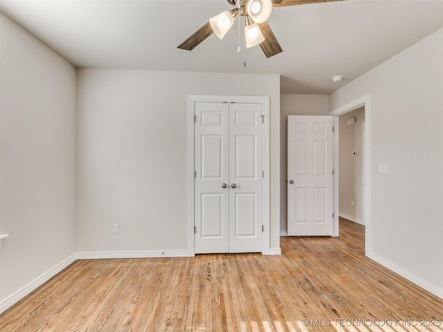 unfurnished bedroom featuring a closet, ceiling fan, and light hardwood / wood-style flooring