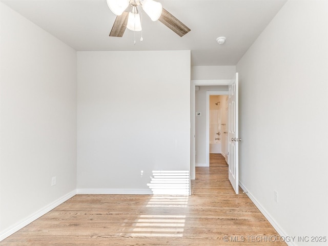 spare room featuring ceiling fan and light hardwood / wood-style flooring