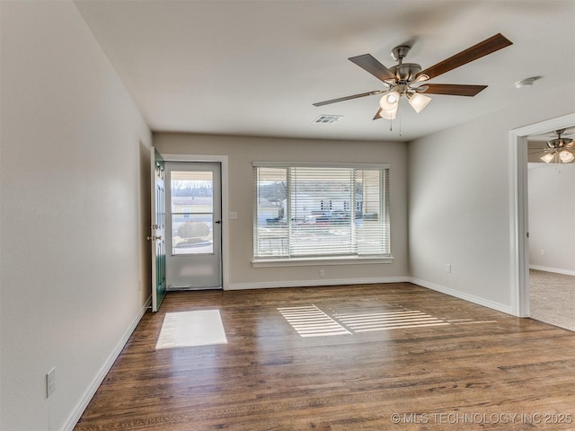 spare room featuring ceiling fan and hardwood / wood-style flooring