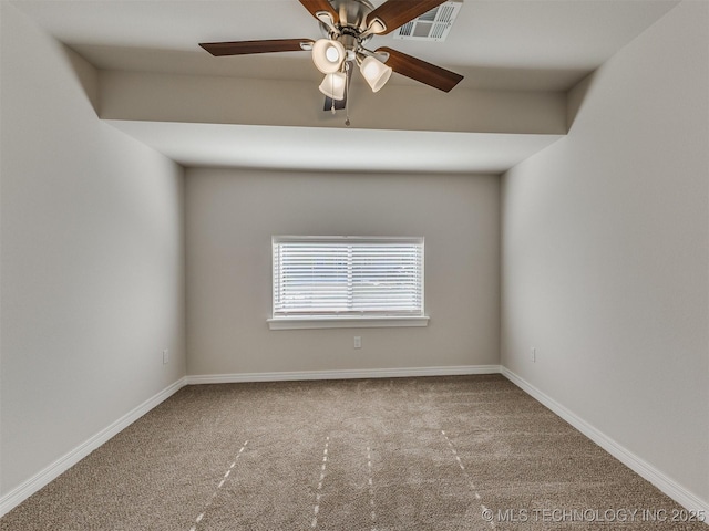 empty room featuring ceiling fan and carpet