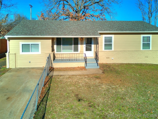 ranch-style home with covered porch and a front yard