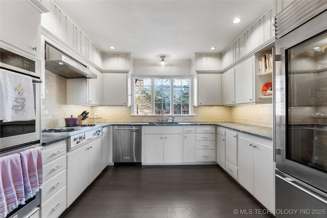 kitchen featuring stainless steel appliances, sink, and white cabinets