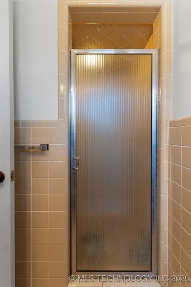 room details featuring an enclosed shower