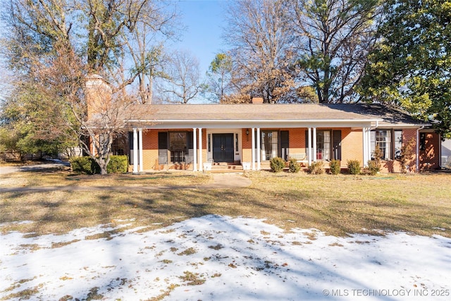 view of front of home with a yard and a porch