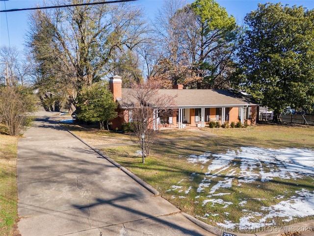 view of front facade with a porch and a yard