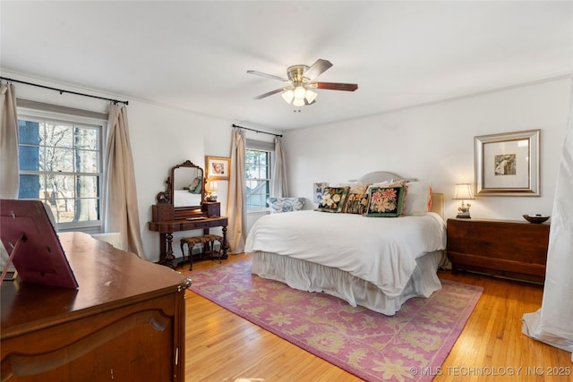 bedroom featuring ceiling fan and light wood-type flooring