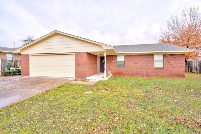 ranch-style house with a garage and a front yard