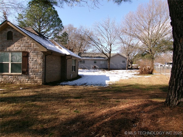 view of property exterior with a yard