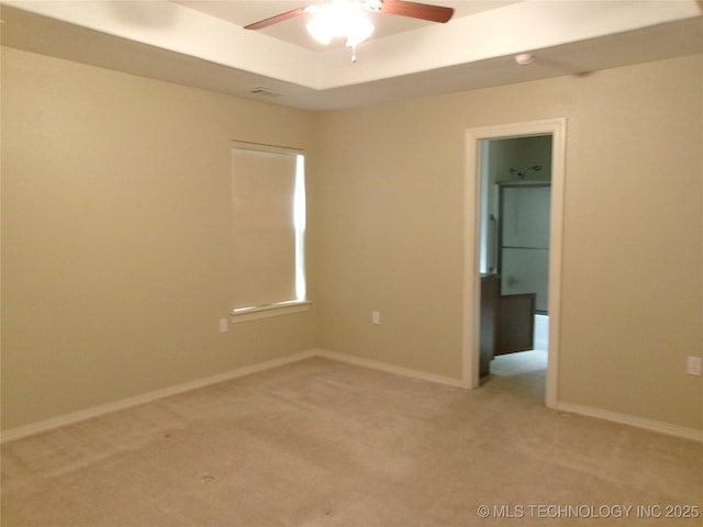 spare room featuring ceiling fan and carpet flooring