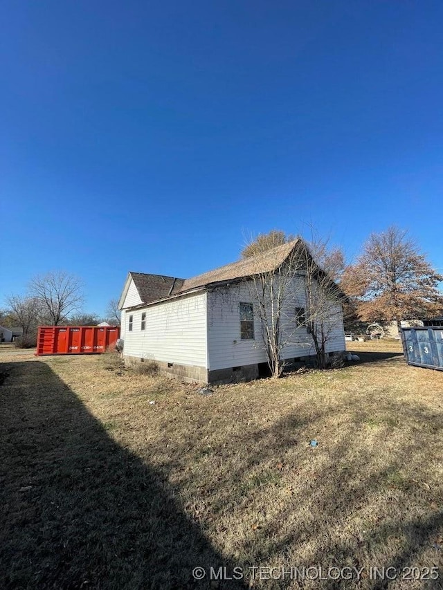 view of property exterior with a yard