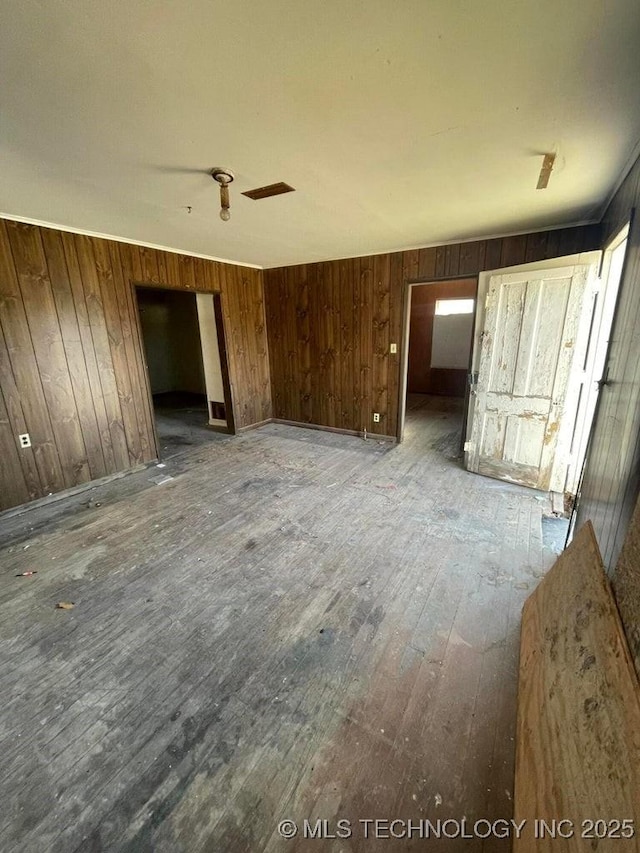 empty room featuring wood-type flooring