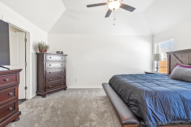 carpeted bedroom with vaulted ceiling and ceiling fan