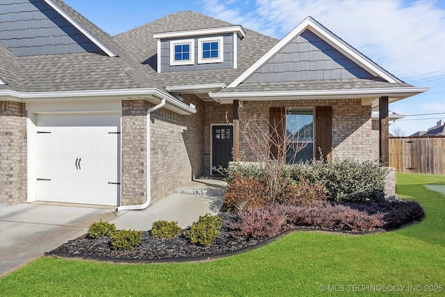 view of front of home featuring a garage and a front yard