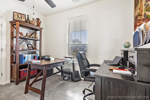 office space featuring ceiling fan and light carpet