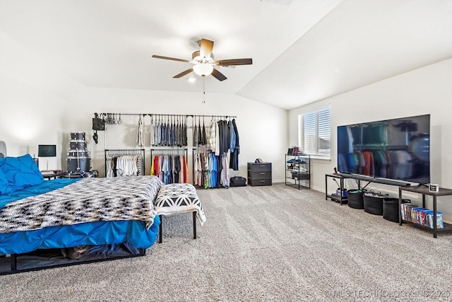 bedroom featuring lofted ceiling, ceiling fan, and carpet