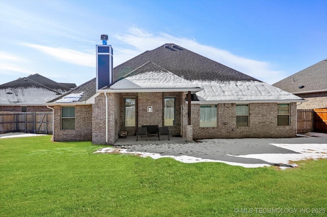 back of house with a patio and a yard