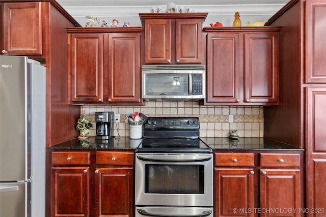 kitchen with stainless steel appliances, dark stone countertops, tasteful backsplash, and crown molding