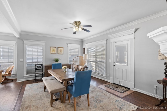 dining room featuring ceiling fan, crown molding, and dark hardwood / wood-style floors