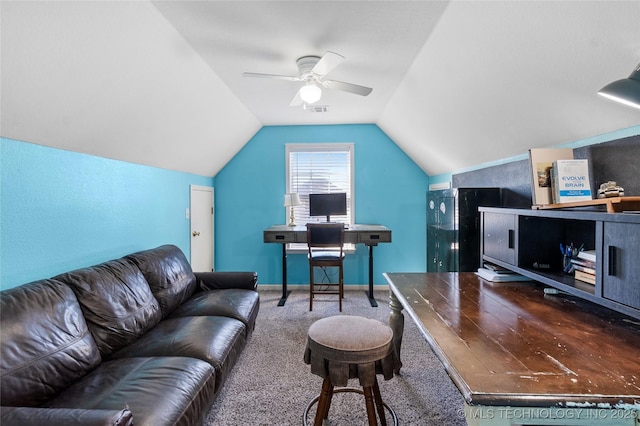 carpeted home office featuring lofted ceiling and ceiling fan