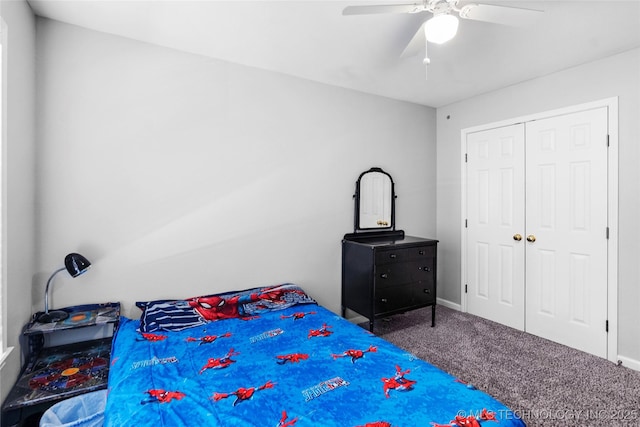 carpeted bedroom featuring ceiling fan and a closet