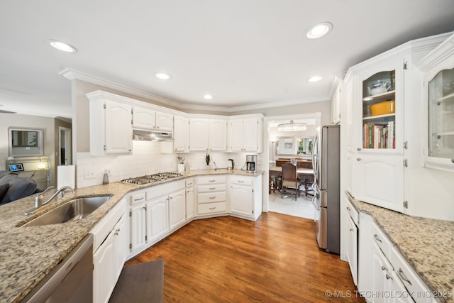 kitchen with sink, stainless steel appliances, white cabinetry, and dark wood-type flooring