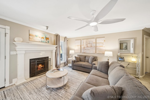 living room featuring ornamental molding and ceiling fan