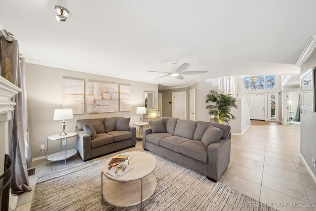 living room featuring light tile patterned flooring, ceiling fan, and crown molding