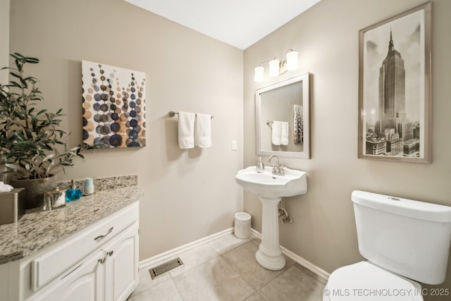 bathroom with tile patterned floors and toilet