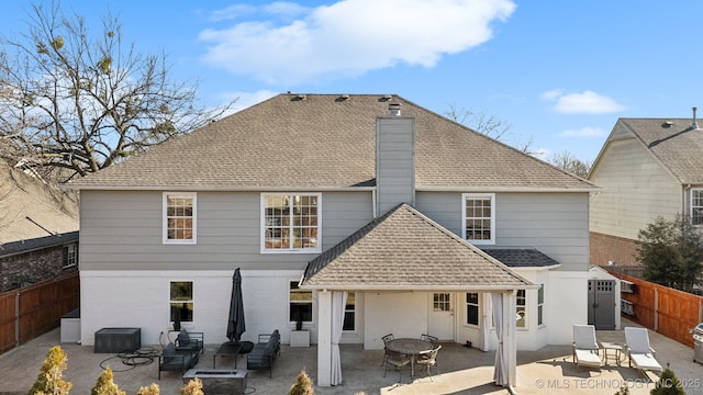 rear view of house with a patio area