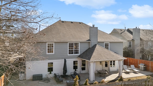 back of house featuring a patio