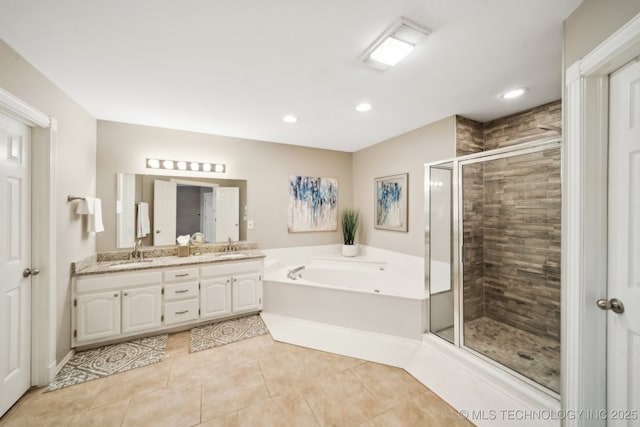 bathroom featuring tile patterned flooring, separate shower and tub, and vanity