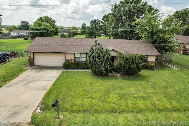 single story home with a front yard and a garage