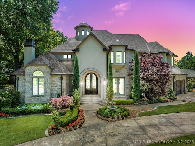 french country style house featuring french doors