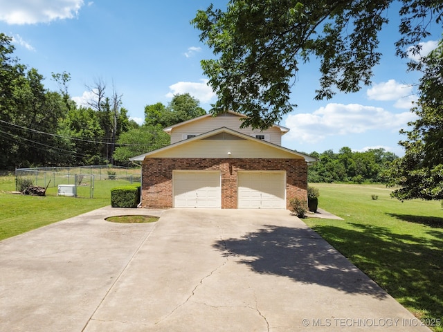 view of side of home with a garage and a lawn